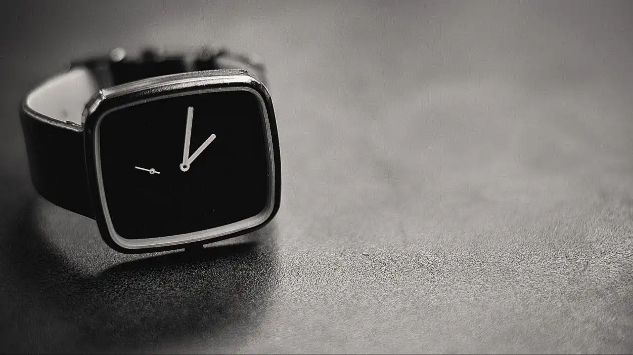 A close-up shot of a minimal wristwatch