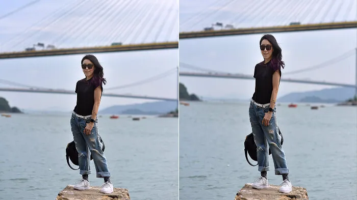 Full-body photo emphasizing taller proportions with vertical background elements.