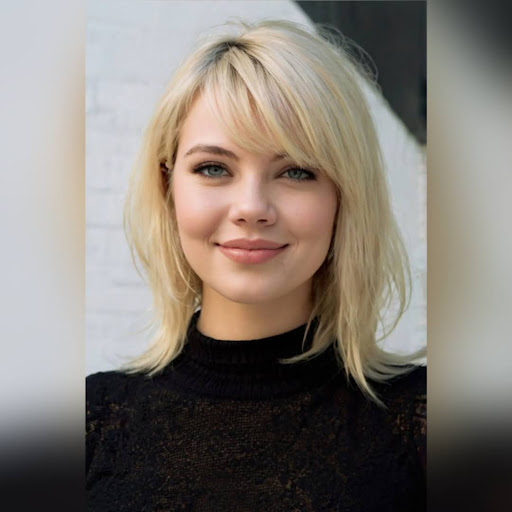 Woman with side-swept bangs hairstyle in a soft, natural style.