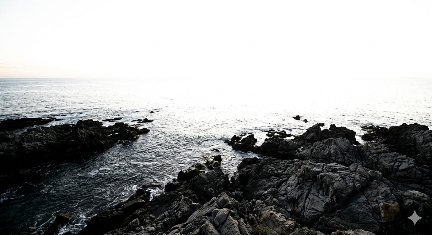 High-contrast coastal photo showing "blown-out" highlights where the sky is pure white and missing all cloud and horizon detail.