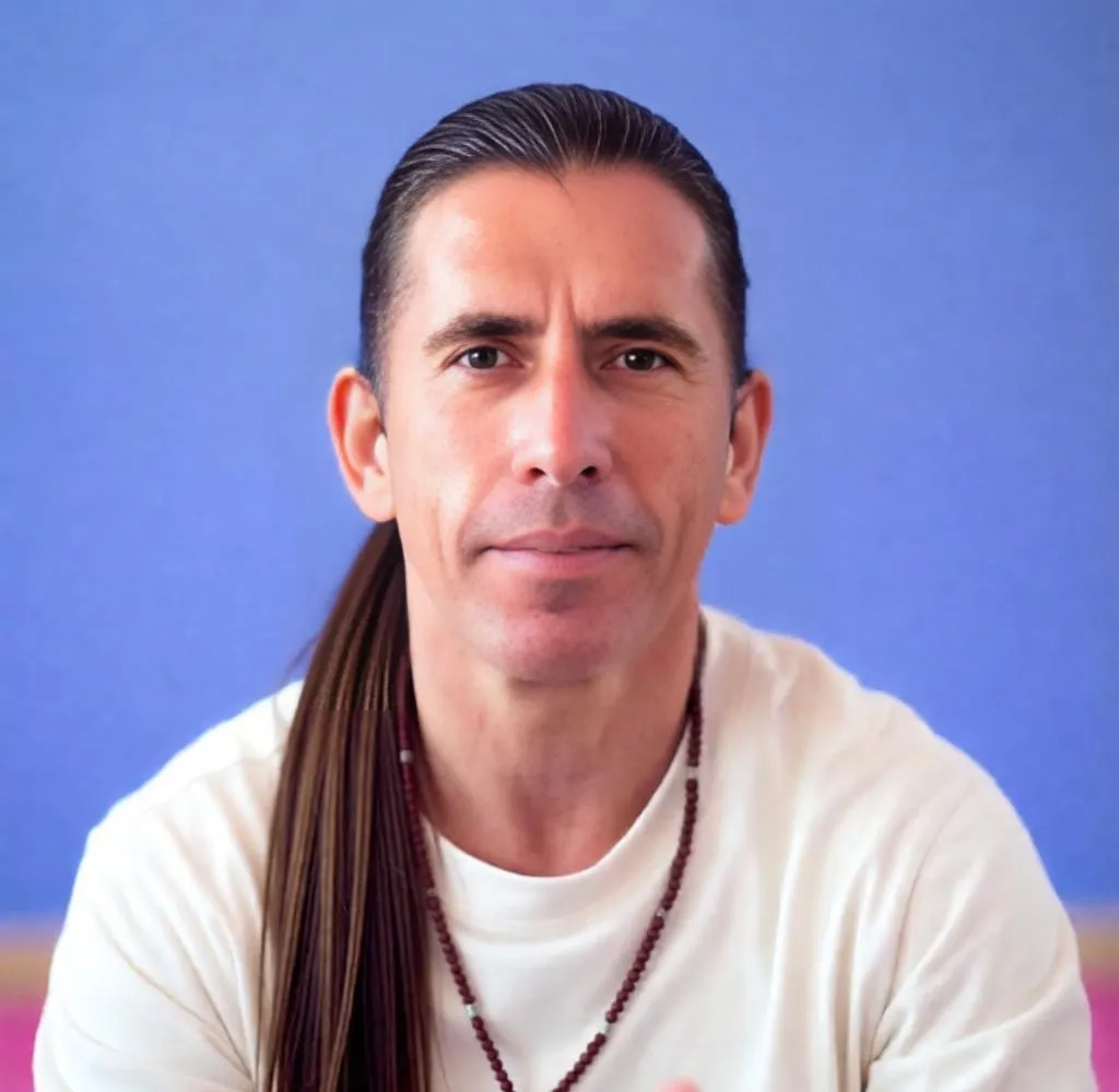 Man with long ponytail, tied back neatly