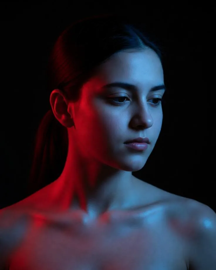 Neon-lit cinematic portrait of a woman in red and blue lighting.