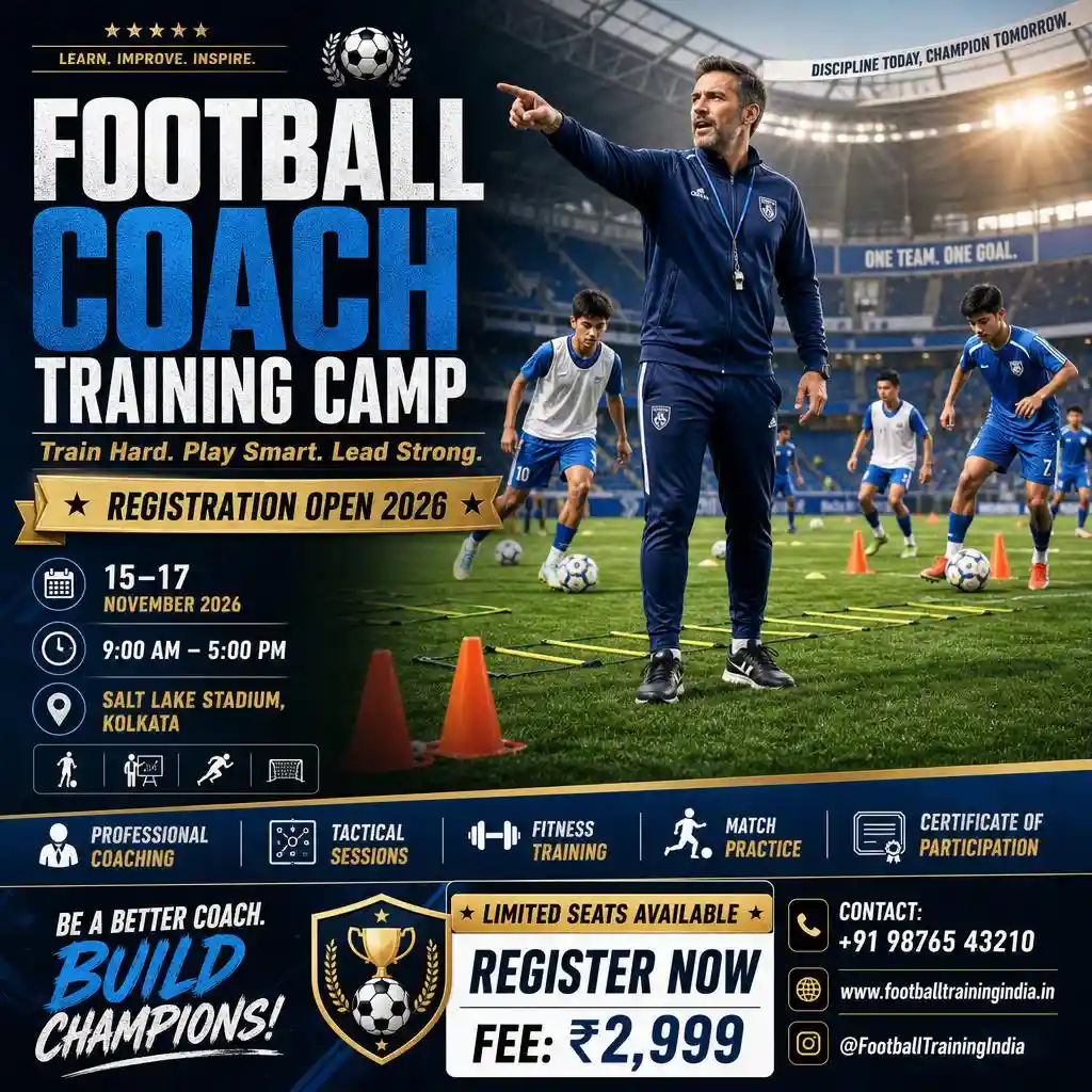 A football coach is training young players during a practice session.