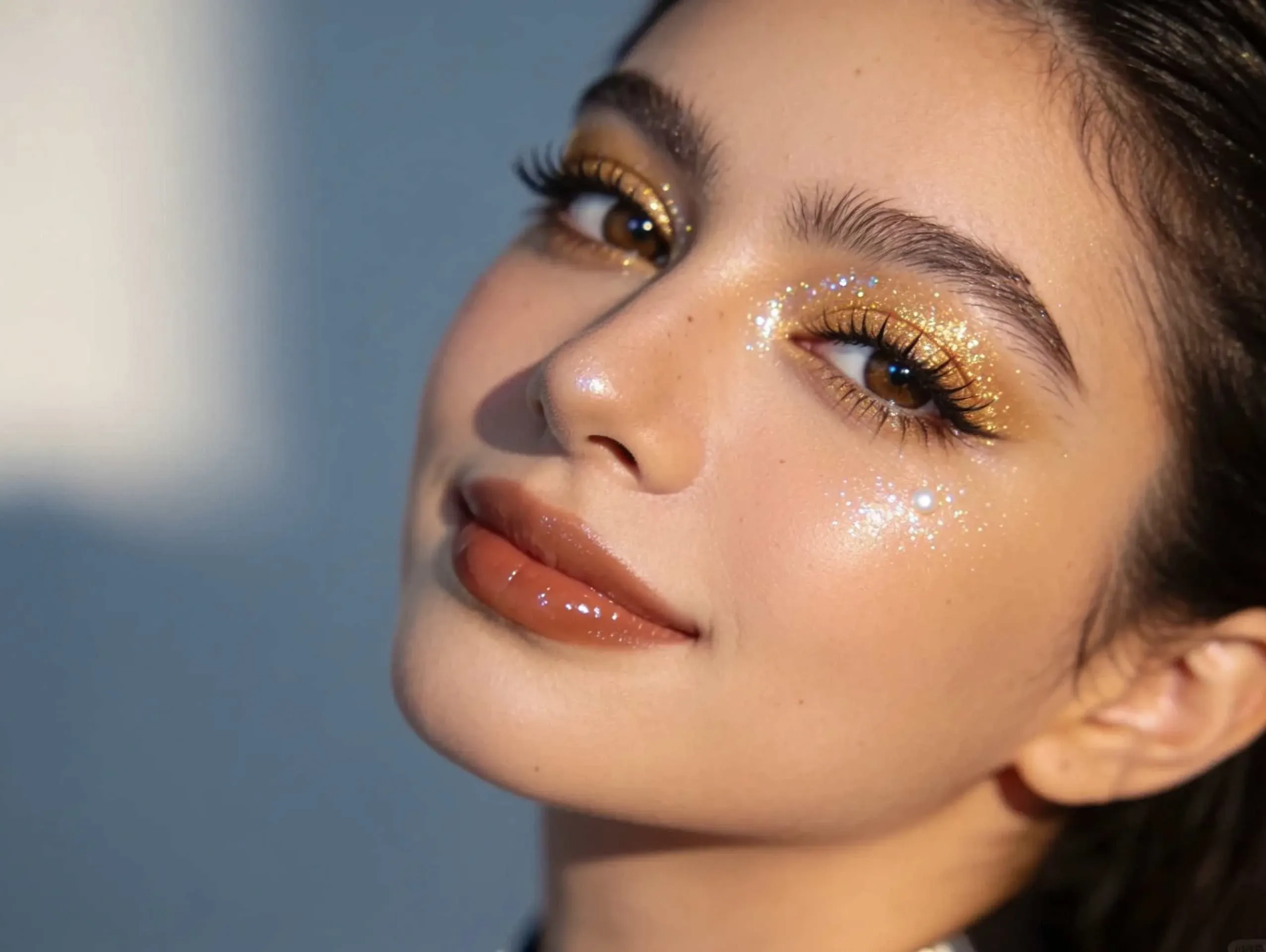 Douyin-inspired makeup with glittery eyes and porcelain skin.
