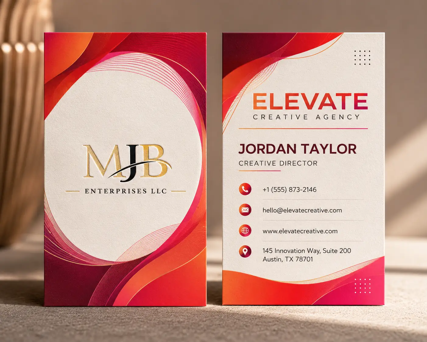 Vibrant vertical two-sided business card pair with red, pink, coral, and orange gradients and modern geometric shapes.